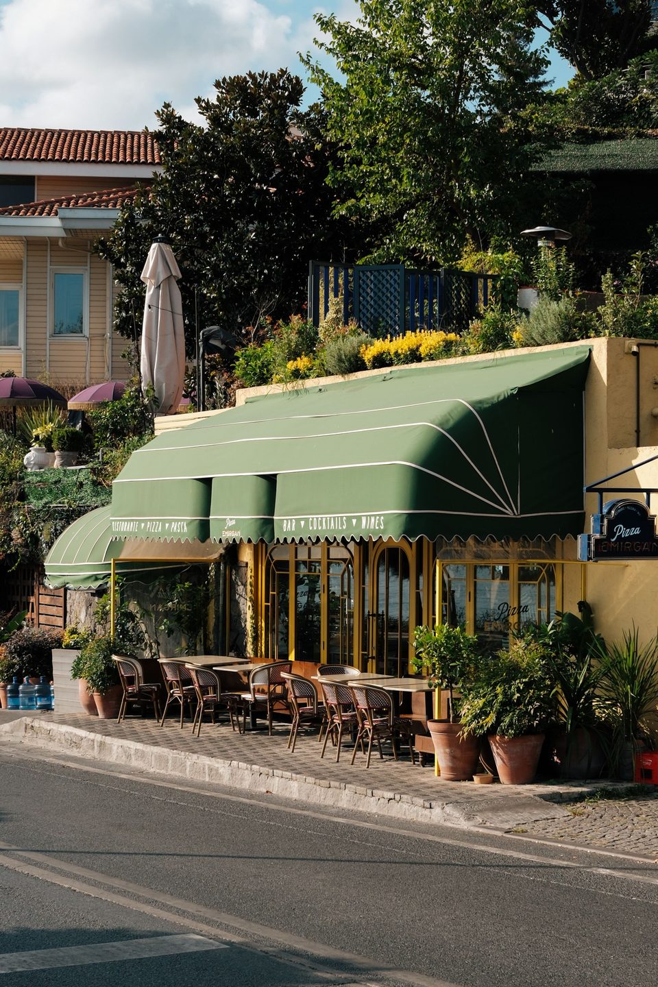 Restaurant with a green street awning. Style example, not an Arc Signage Co project.