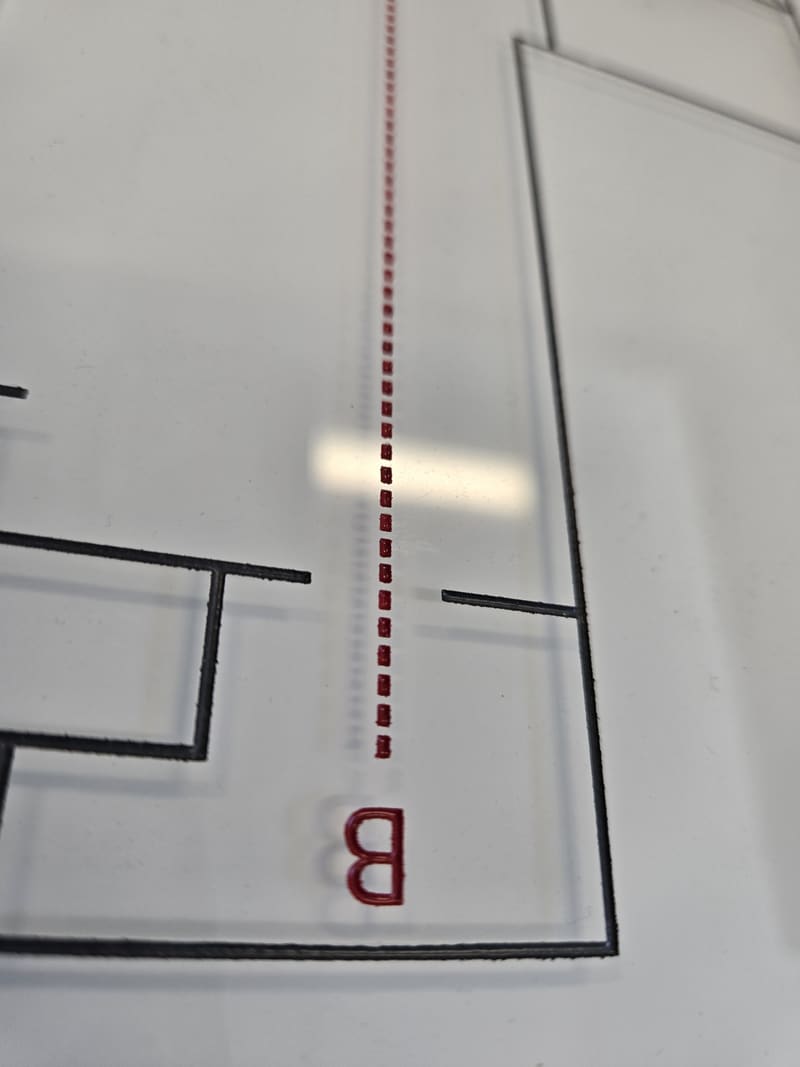 Acrylic sign panels on a production table.