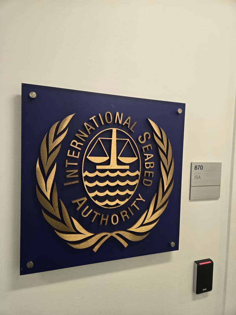 Wall plaque with emblem and dimensional lettering.
