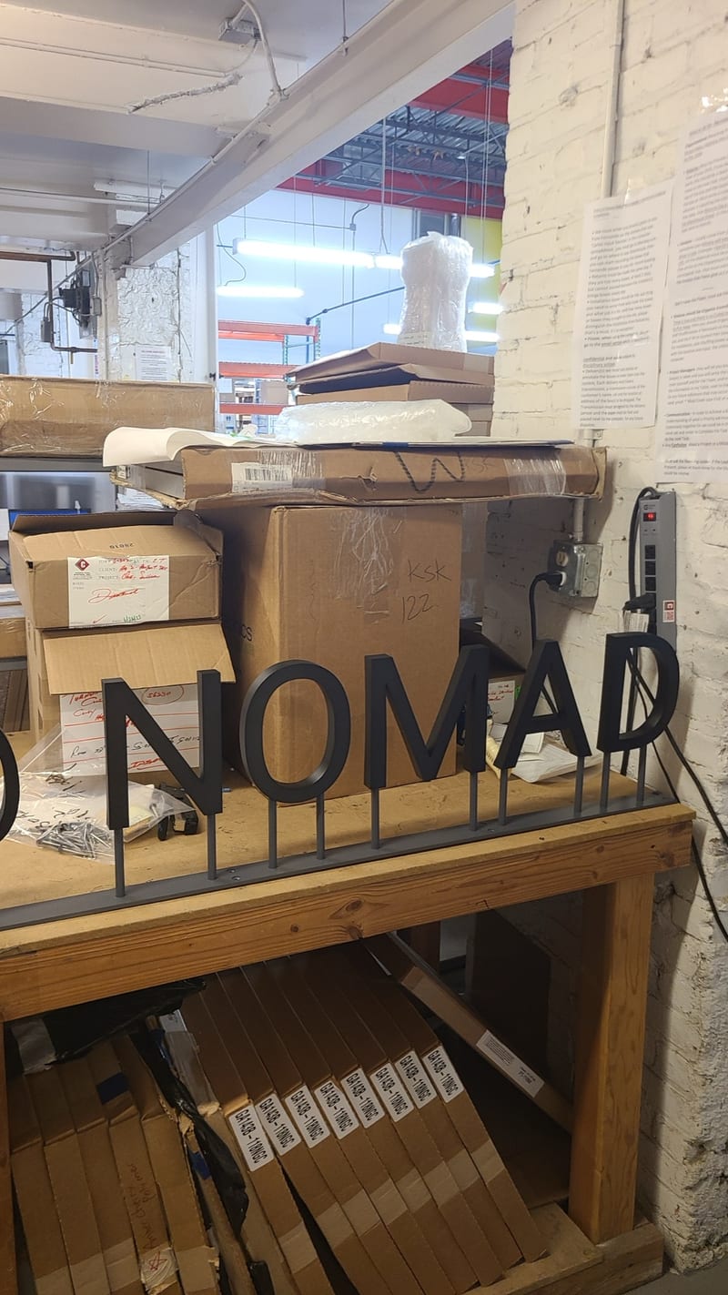 Dimensional letters laid out in a sign shop.