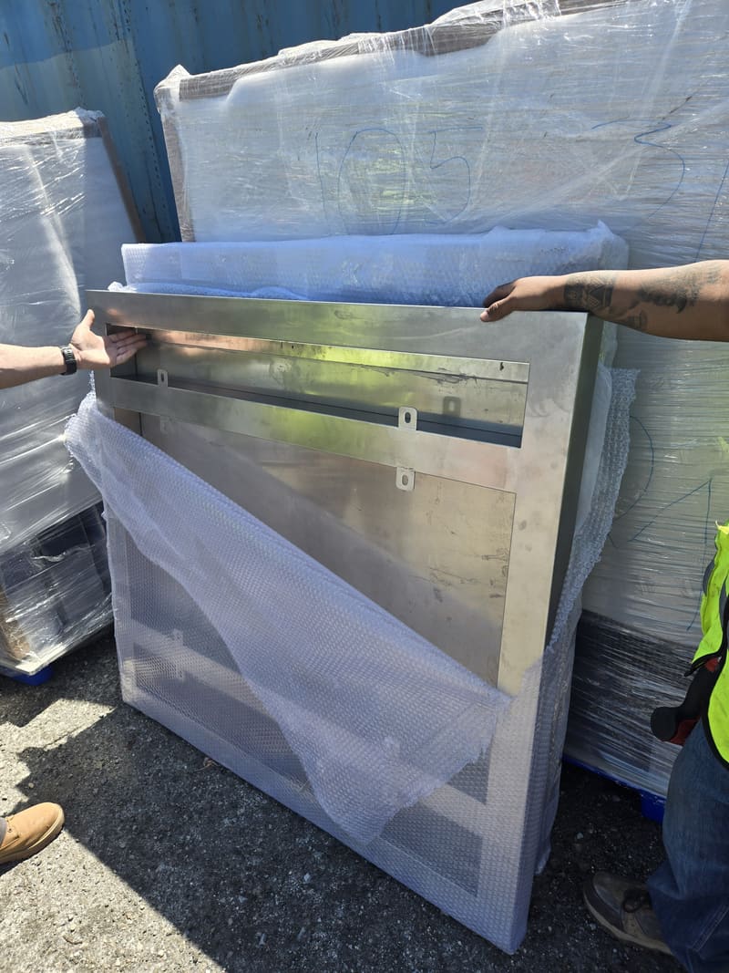 Stainless sign panel wrapped for delivery.